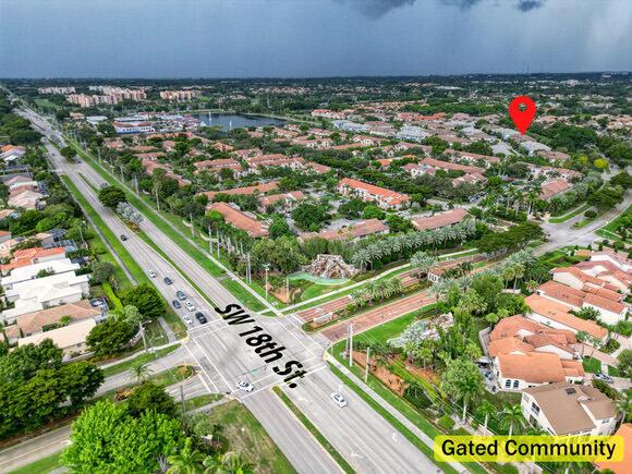 An aerial view shows a suburban neighborhood with a gated community and a major road — 23008 Clear Echo Drive # 11, Boca Raton FL 33433, BOCA RATON, FL