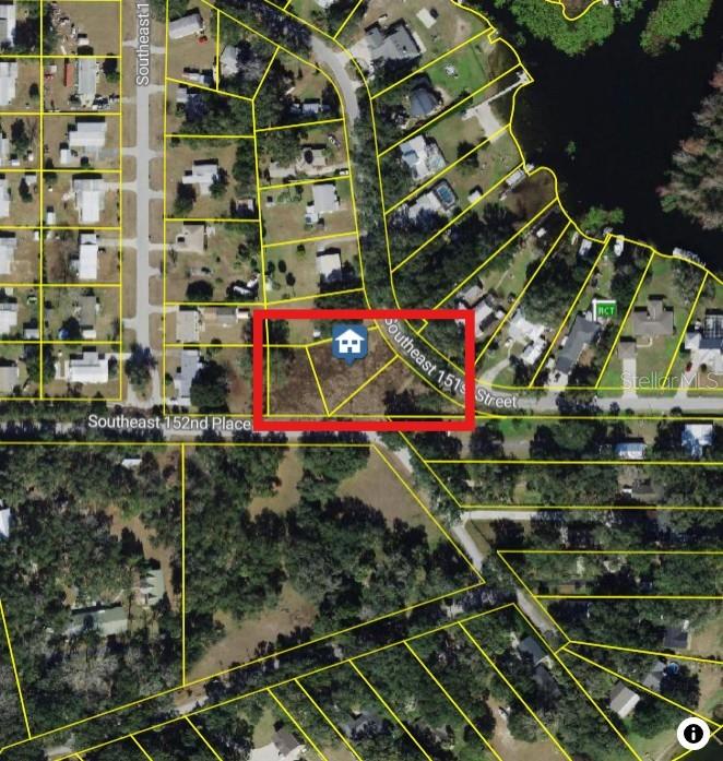 An aerial map view shows a vacant, rectangular residential lot outlined in red — SE 152ND PLACE, SUMMERFIELD, FL