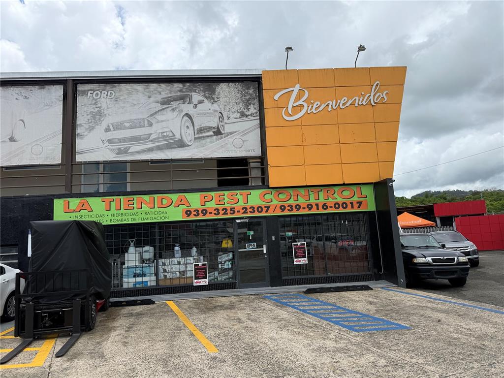 The exterior of a commercial building features a pest control store with a large sign — PR-183 KM 1.7 TOMAS DE CASTRO WARD, CAGUAS, PR