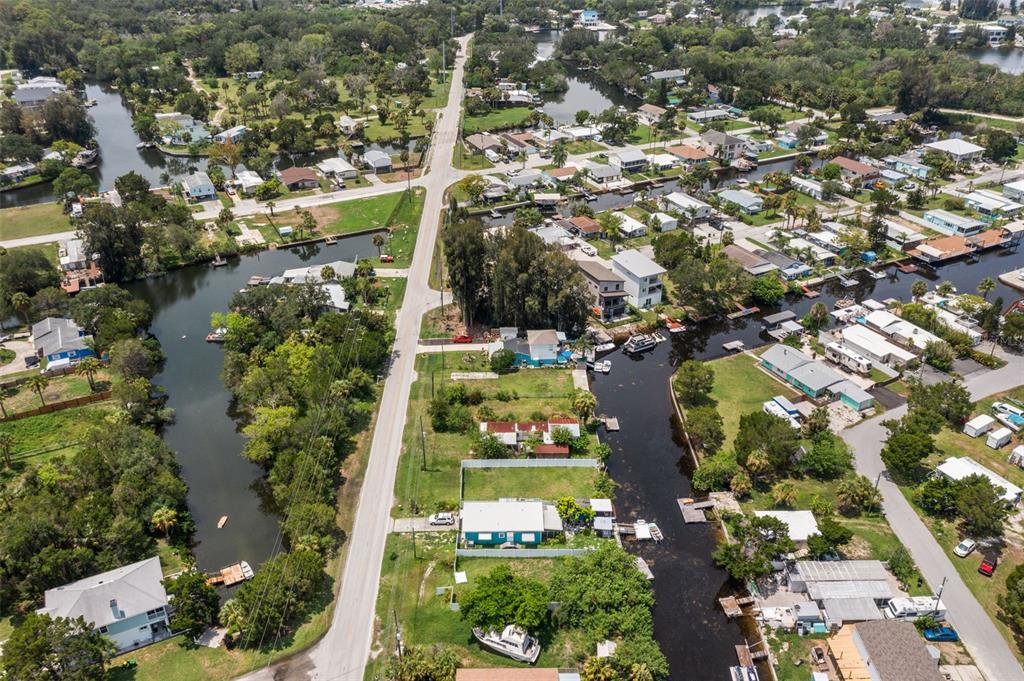 An aerial view shows a residential neighborhood with houses situated along narrow, interconnected canals — 0 OLD DIXIE HIGHWAY, HUDSON, FL