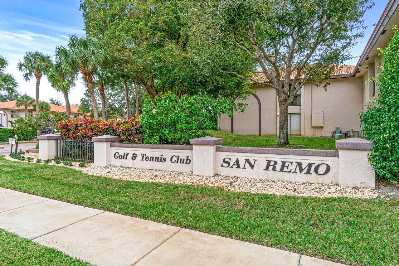A sign for the San Remo Golf & Tennis Club stands before a residential building — 5200 E Club Circle # 106, Boca Raton FL 33487, BOCA RATON, FL