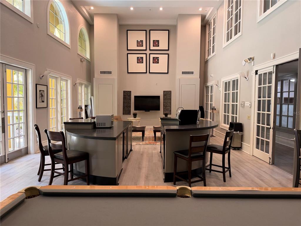A courtyard features a central stone fountain surrounded by palm trees and paved walkways — 860 N ORANGE AVENUE UNIT 379, ORLANDO, FL