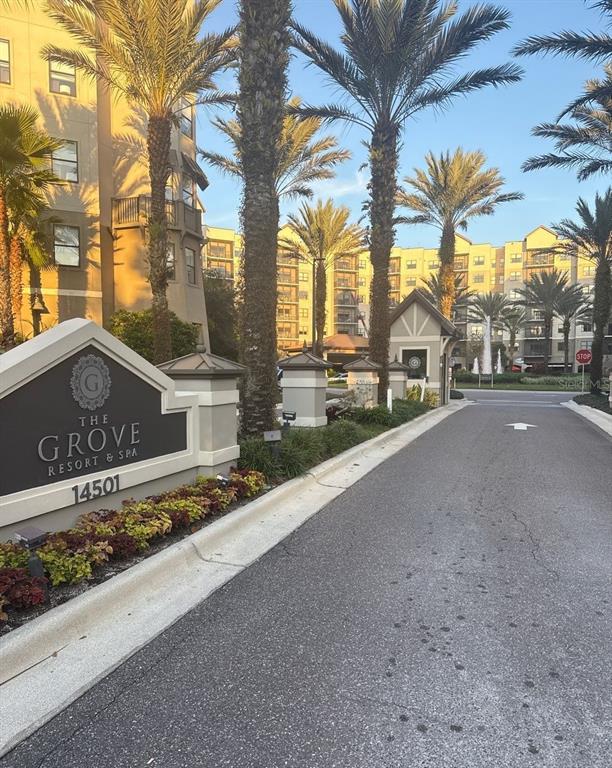 The entrance to The Grove Resort and Spa features a monument sign and palm trees — 14501 GROVE RESORT AVENUE UNIT 2616, WINTER GARDEN, FL