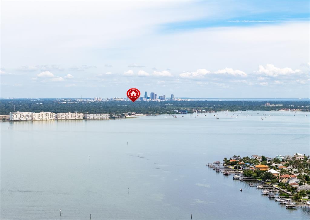 An aerial view shows a large body of water with a city skyline in the distance — 1703 12TH STREET S, ST PETERSBURG, FL