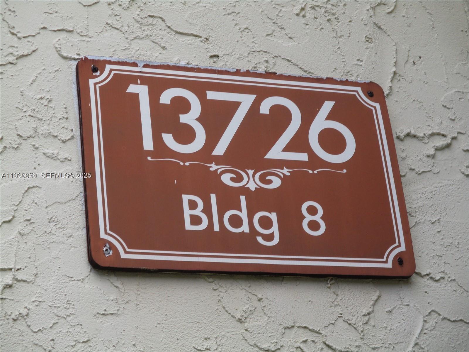 A brown rectangular sign with white text reading 13726 and Bldg 8 is mounted outdoors — 13726 SW 90th Ave # 26, Miami FL 33176, MIAMI, FL