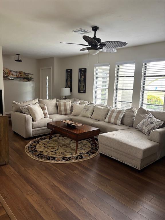 A living room features a large sectional sofa, a coffee table, and a ceiling fan — 17071 WATERS EDGE CIRCLE, NORTH FORT MYERS, FL