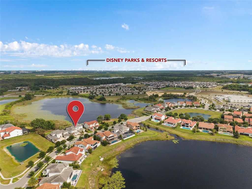 An aerial view shows a residential neighborhood with houses, lakes, and a red location pin — 15522 SHOREBIRD LANE, WINTER GARDEN, FL