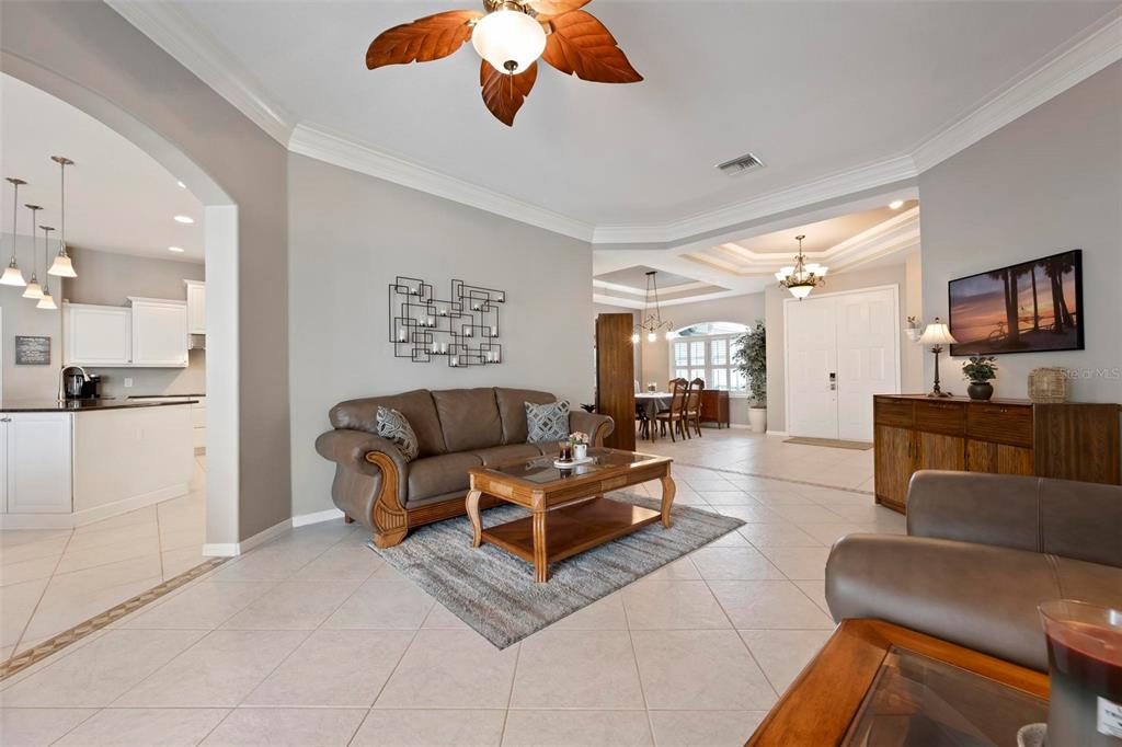 An aerial view shows a residential neighborhood with a school in the distance — 7572 PALMER GLEN CIRCLE, SARASOTA, FL