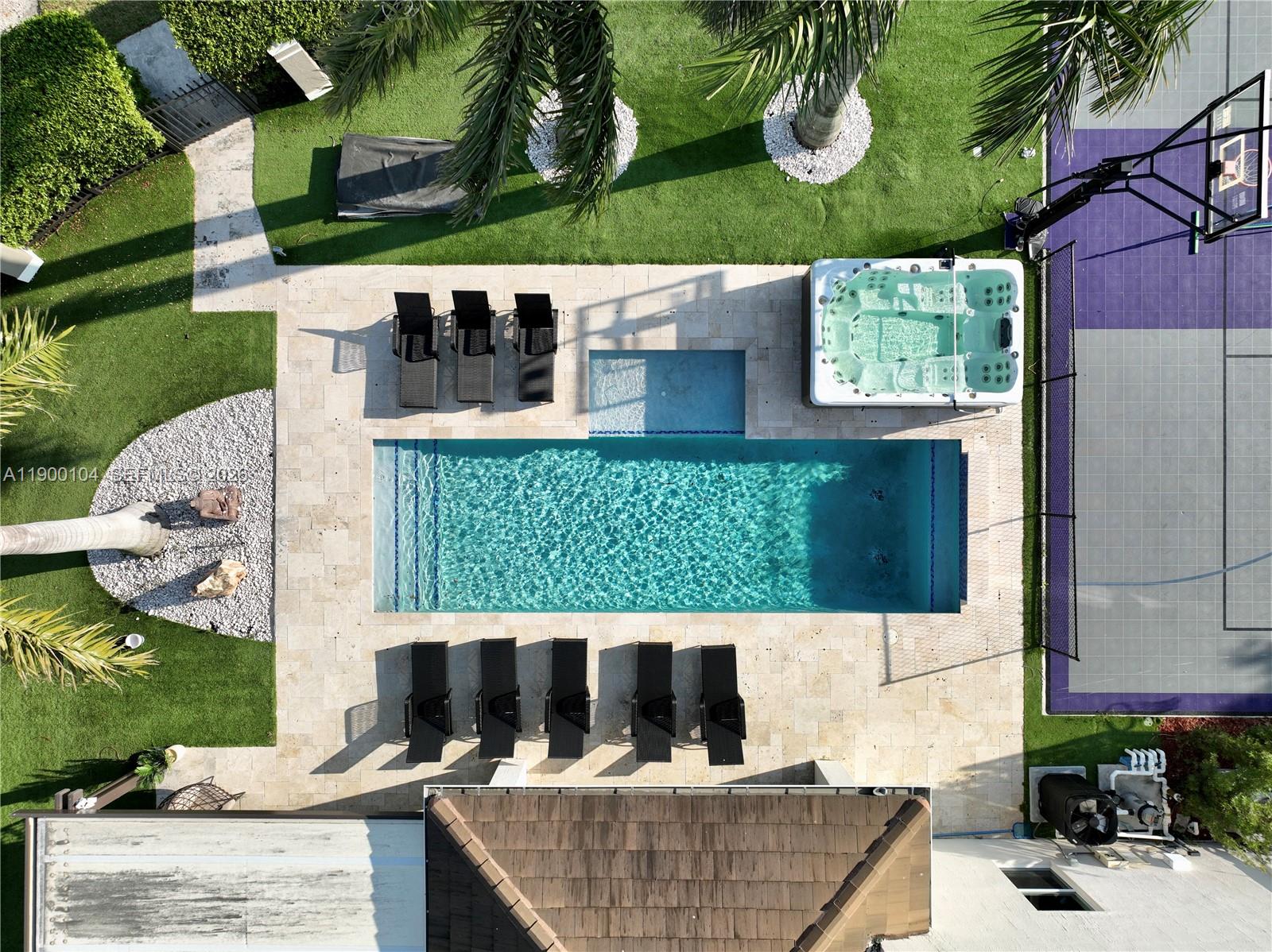 An aerial view shows a backyard with a rectangular pool, hot tub, and basketball court — 11 NW 122nd Ave, Miami FL 33182, MIAMI, FL