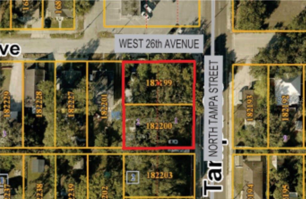 This is an aerial map showing two adjacent rectangular lots outlined in red — 3210 N TAMPA STREET, TAMPA, FL