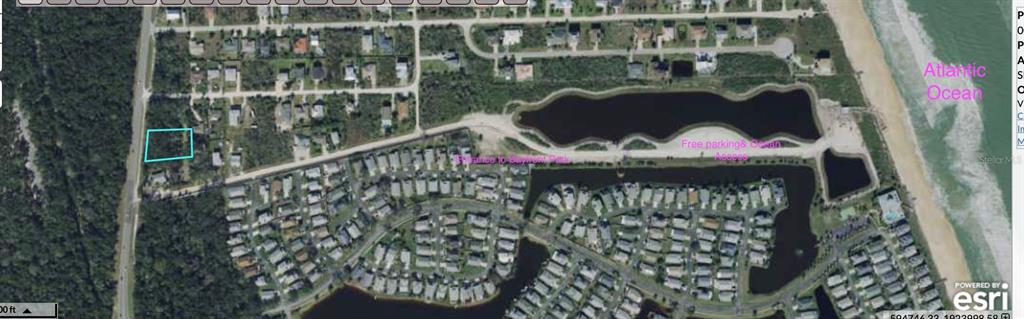 This aerial map shows a vacant residential lot outlined in blue near a coastal neighborhood — 6169 N OCEAN SHORE BOULEVARD, PALM COAST, FL