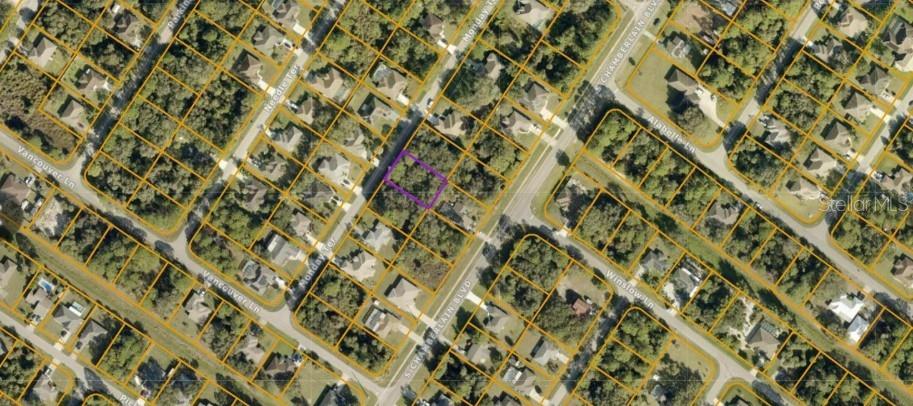 This is an aerial map showing a vacant residential lot outlined in purple — MONDAY TERRACE, NORTH PORT, FL