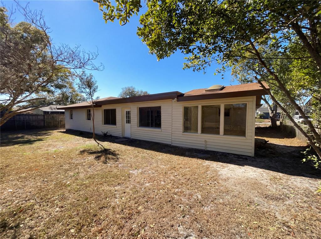 The exterior of a single-story house with light siding and a brown roof — 2052 LEANNE COURT, WINTER PARK, FL