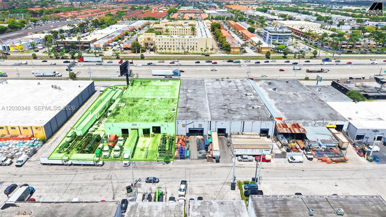 An aerial view shows a green-highlighted industrial warehouse building with a loading dock area — 7435 W 20th Ave, Hialeah FL 33014, HIALEAH, FL