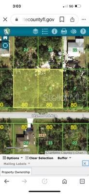 This is a digital map showing property lot lines and parcel numbers for a residential area — 13342 DRUMMOND AVENUE, PORT CHARLOTTE, FL
