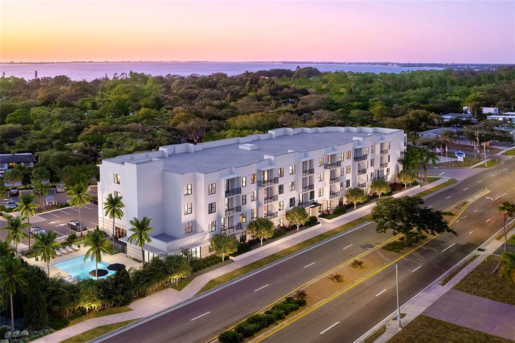 This is a digital rendering of a multi-story apartment building with a pool and parking — 4950 REMINGTON DRIVE UNIT 401, SARASOTA, FL