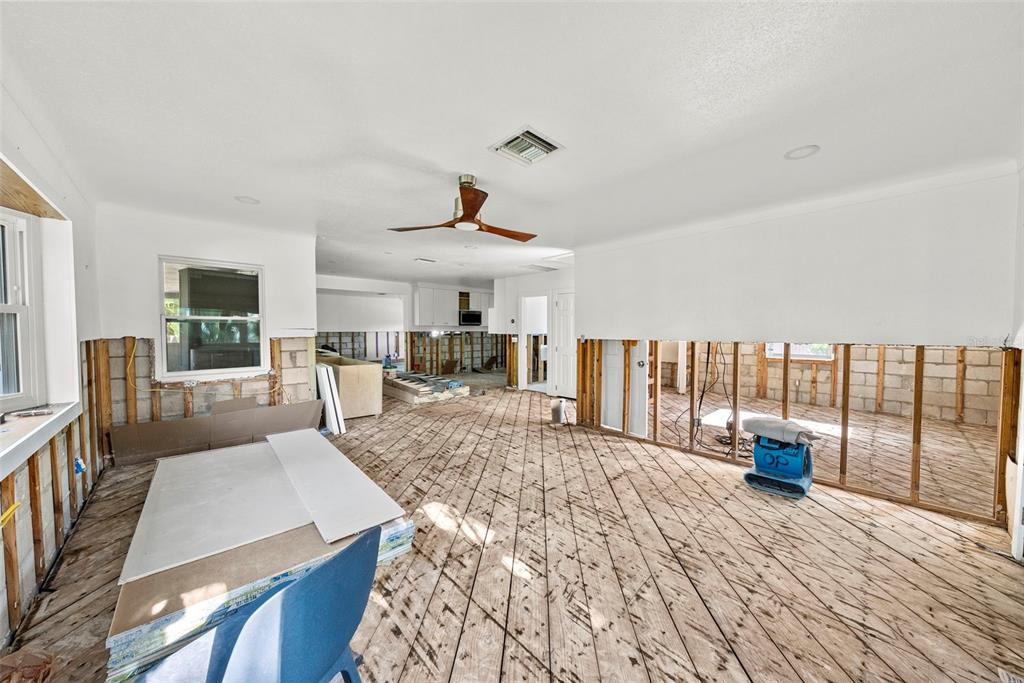 An interior view of a room under renovation with exposed wall studs and unfinished flooring — 2657 44TH STREET S, GULFPORT, FL