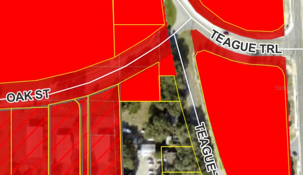 This is a map showing property boundaries highlighted in red near Oak Street and Teague Trail — OAK STREET, LADY LAKE, FL
