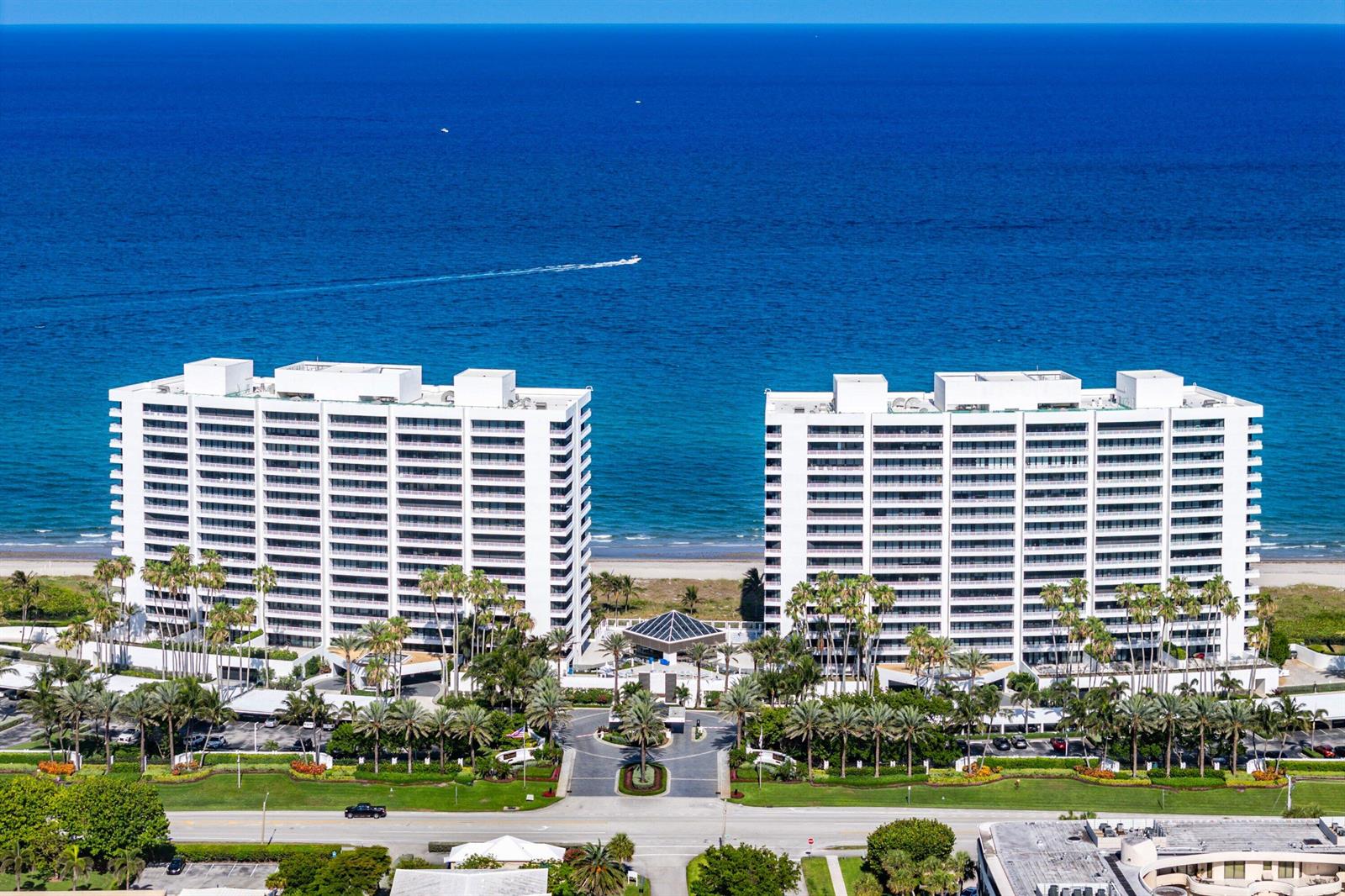 An aerial view of two white high-rise residential buildings situated along a sandy beach — 1500 S Ocean Boulevard # 604, Boca Raton FL 33432, BOCA RATON, FL