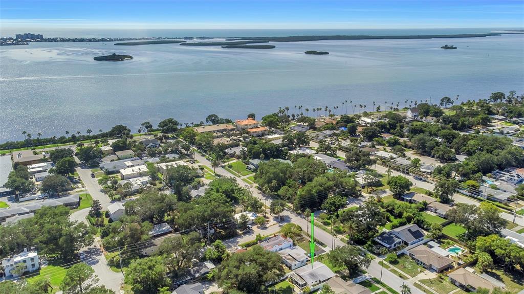 An aerial view shows a residential neighborhood near a large body of water — 1109 MARINE STREET, CLEARWATER, FL
