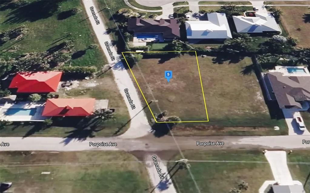 An aerial map view shows a vacant, rectangular residential lot located at a street corner — 1715 PORPOISE AVENUE, FORT PIERCE, FL