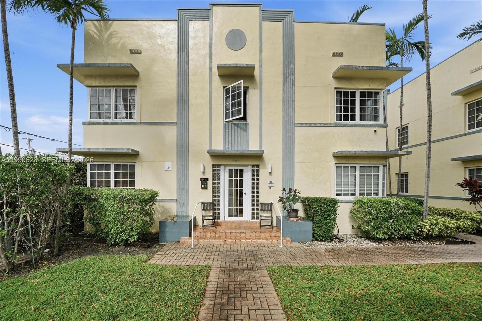 A two-story Art Deco apartment building features a central entrance with glass block accents — 600 Euclid Ave # A2, Miami Beach FL 33139, MIAMI BEACH, FL