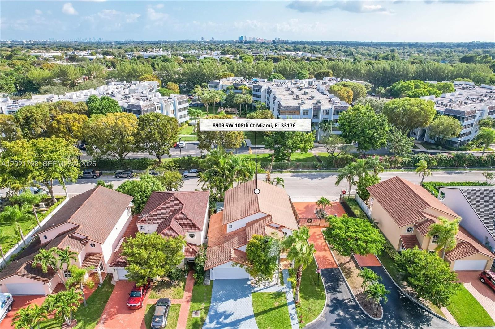 An aerial view shows a suburban residential street with several houses and apartment buildings — 8909 SW 108th Cir Ct, Miami FL 33176, MIAMI, FL
