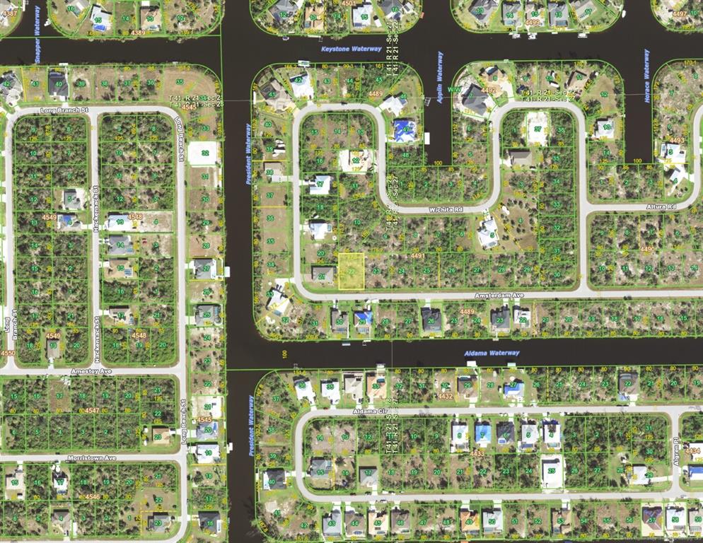 This is an aerial map showing residential lots, streets, and waterways in a suburban neighborhood — 14988 AMSTERDAM AVENUE, PORT CHARLOTTE, FL