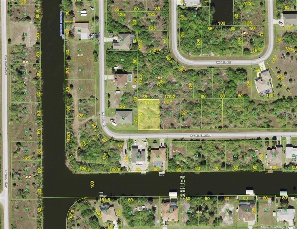 This is a satellite map showing residential lots and streets in a suburban neighborhood — 14988 AMSTERDAM AVENUE, PORT CHARLOTTE, FL