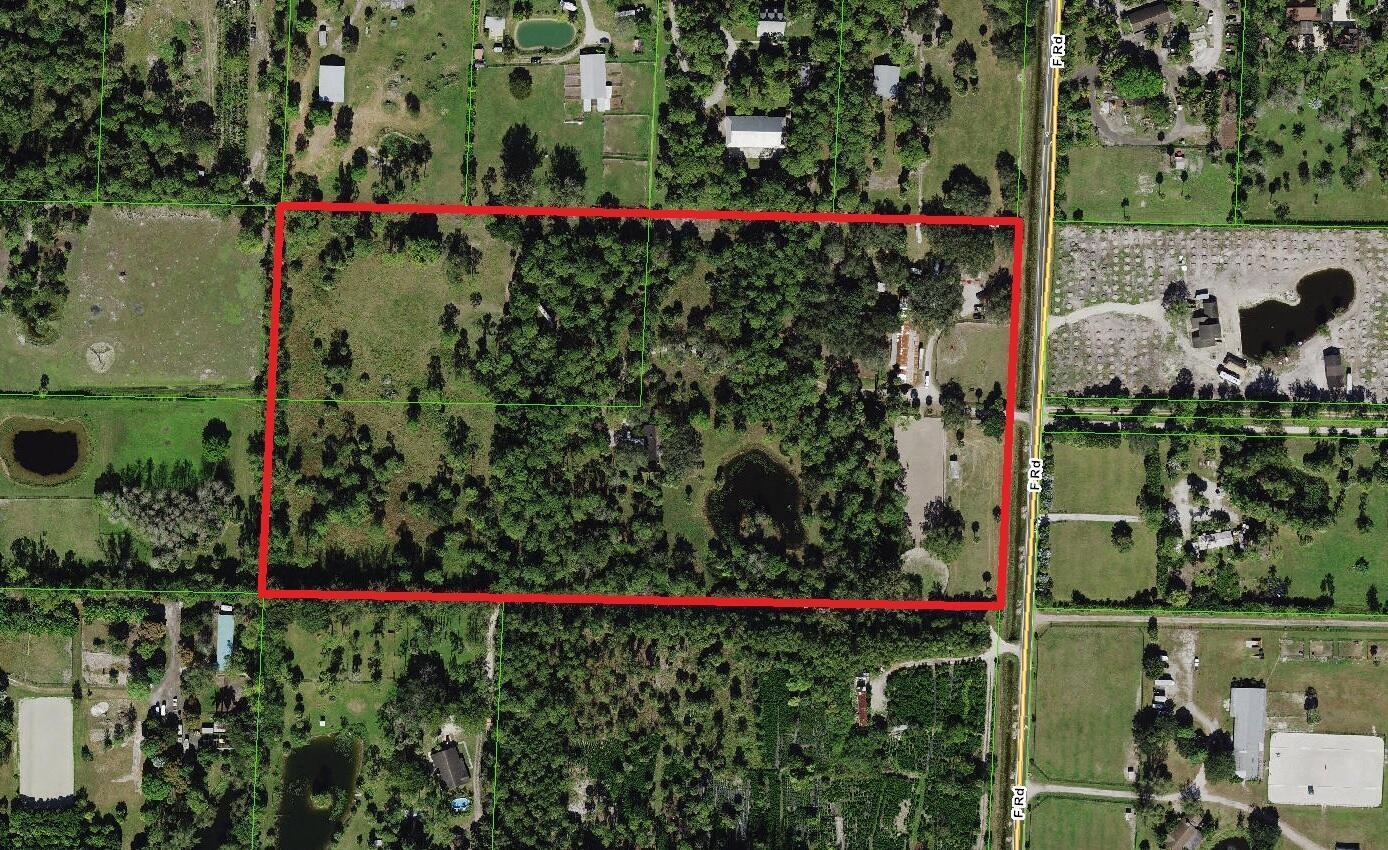 An aerial map shows a rectangular property outlined in red along a paved road — 2833 F Road, FL 33470, FL