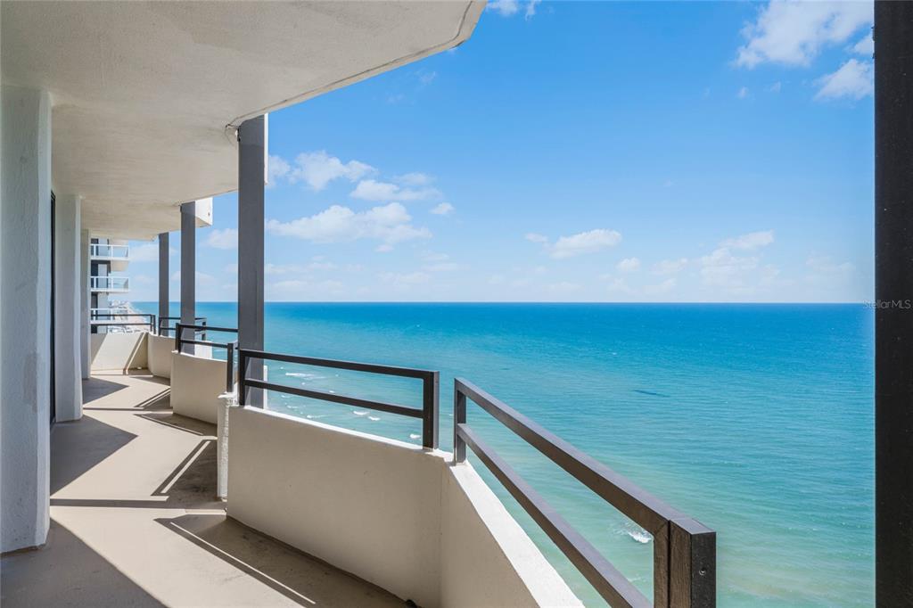 A high-rise balcony overlooks the ocean with a metal railing and concrete floor — 2900 N ATLANTIC AVENUE UNIT 2001, DAYTONA BEACH, FL