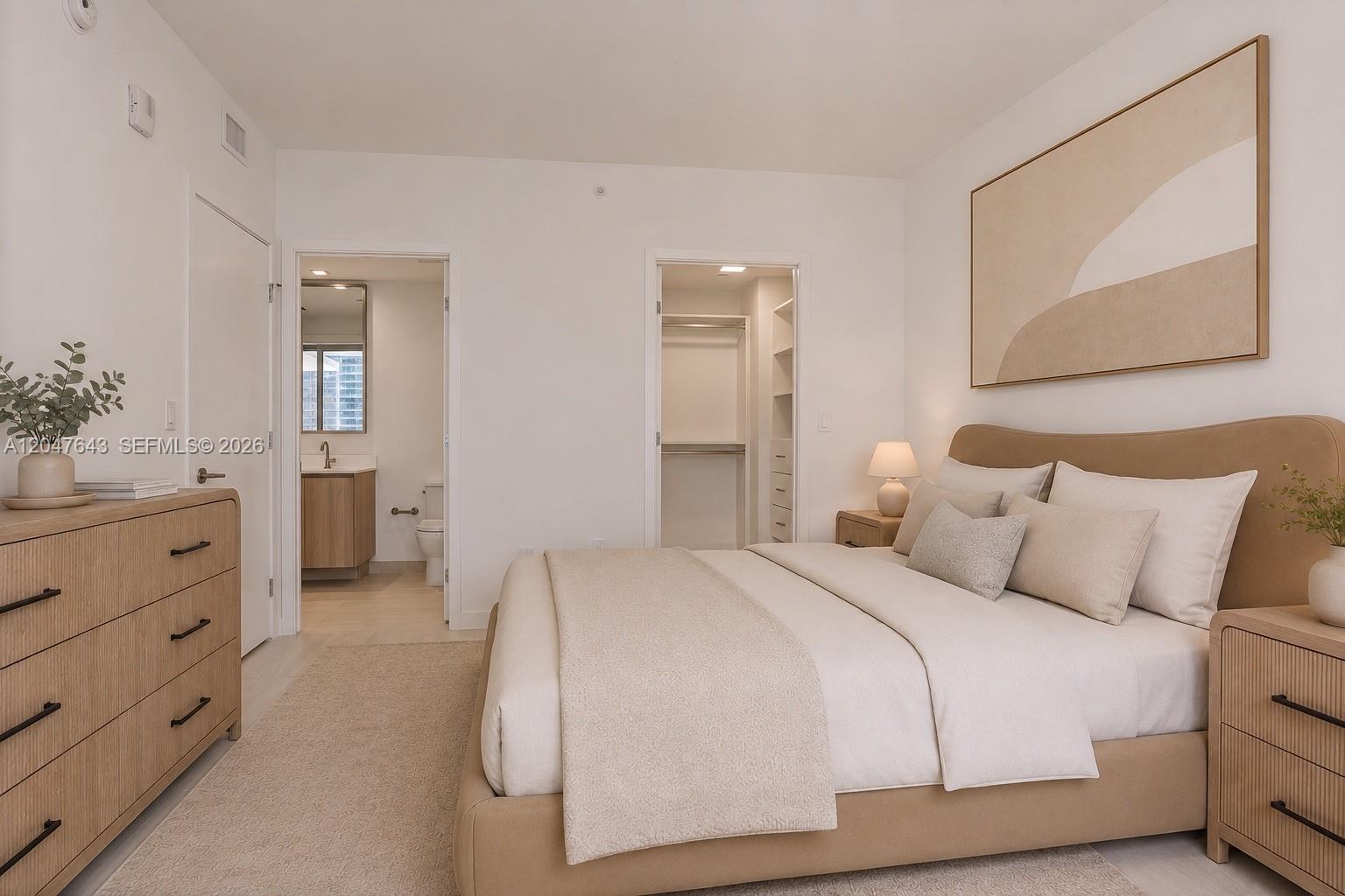 A bedroom features a bed with a tan headboard, a dresser, and two doorways — 77 SE 5th St. # 1905, Miami FL 33131, MIAMI, FL
