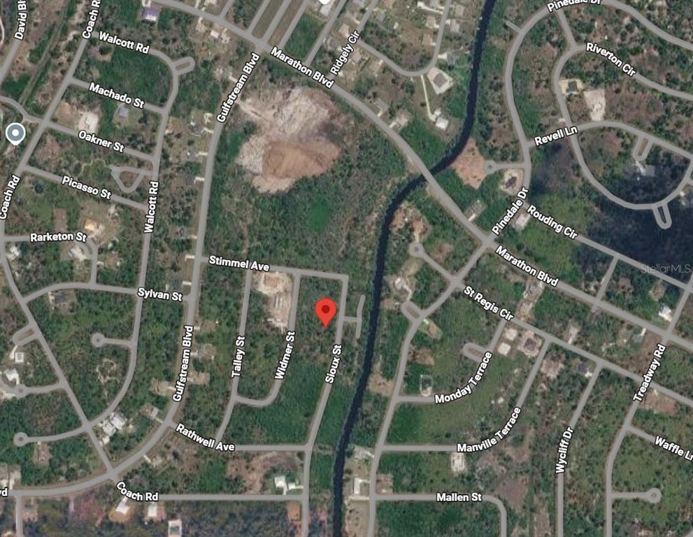 This is a satellite map view showing a vacant residential lot marked with a pin — 7373 SIOUX STREET, PORT CHARLOTTE, FL