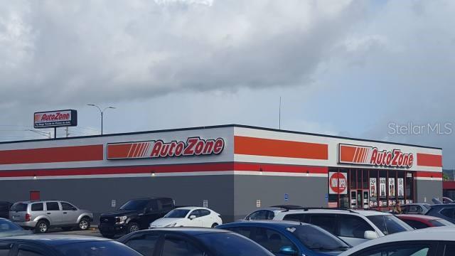 An exterior view of an AutoZone retail store building with a parking lot in front — 1 PR-1 INT. LEONICIO VELAZQUEZ, CAGUAS, PR