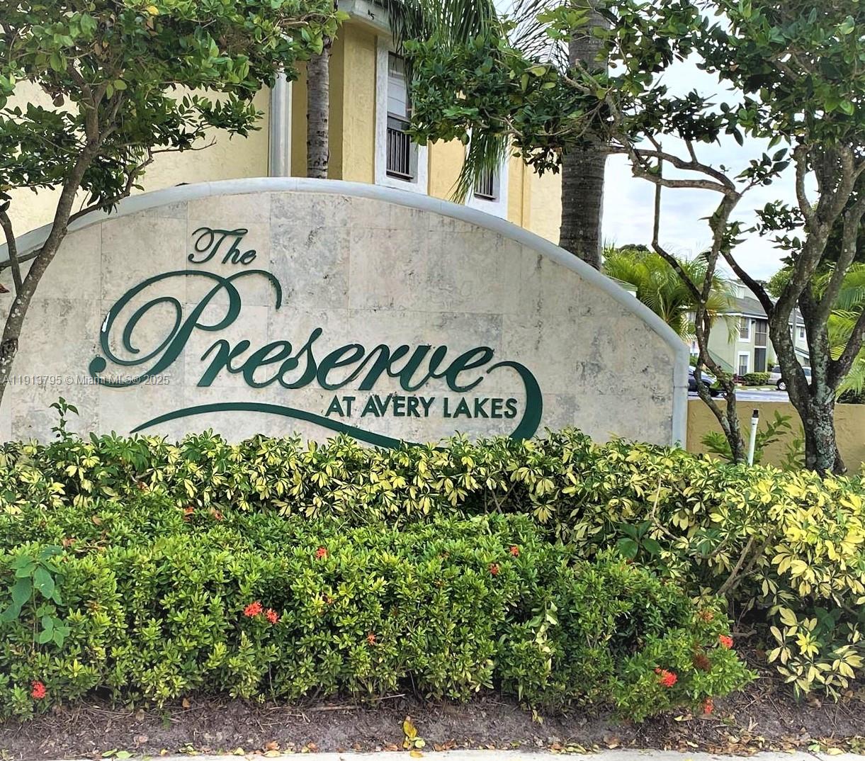 A stone monument sign for The Preserve at Avery Lakes sits behind landscaped bushes — 3992 NW 87th Ave # 3992, Sunrise FL 33351, SUNRISE, FL