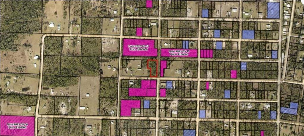 An aerial map shows a grid of land parcels with some lots highlighted in pink — GARDENIA STREET, FOUNTAIN, FL
