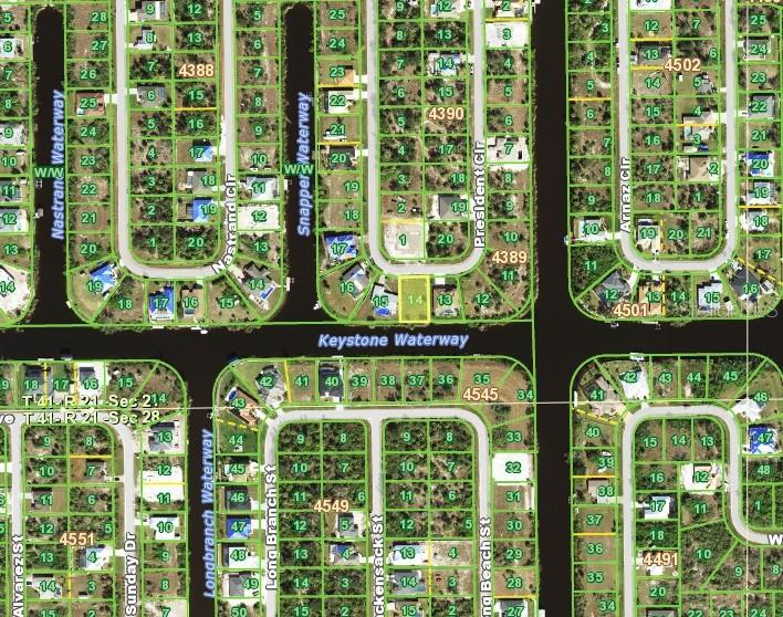 This is an aerial map showing residential lots and waterways in a suburban neighborhood — 9580 PRESIDENT CIRCLE, PORT CHARLOTTE, FL