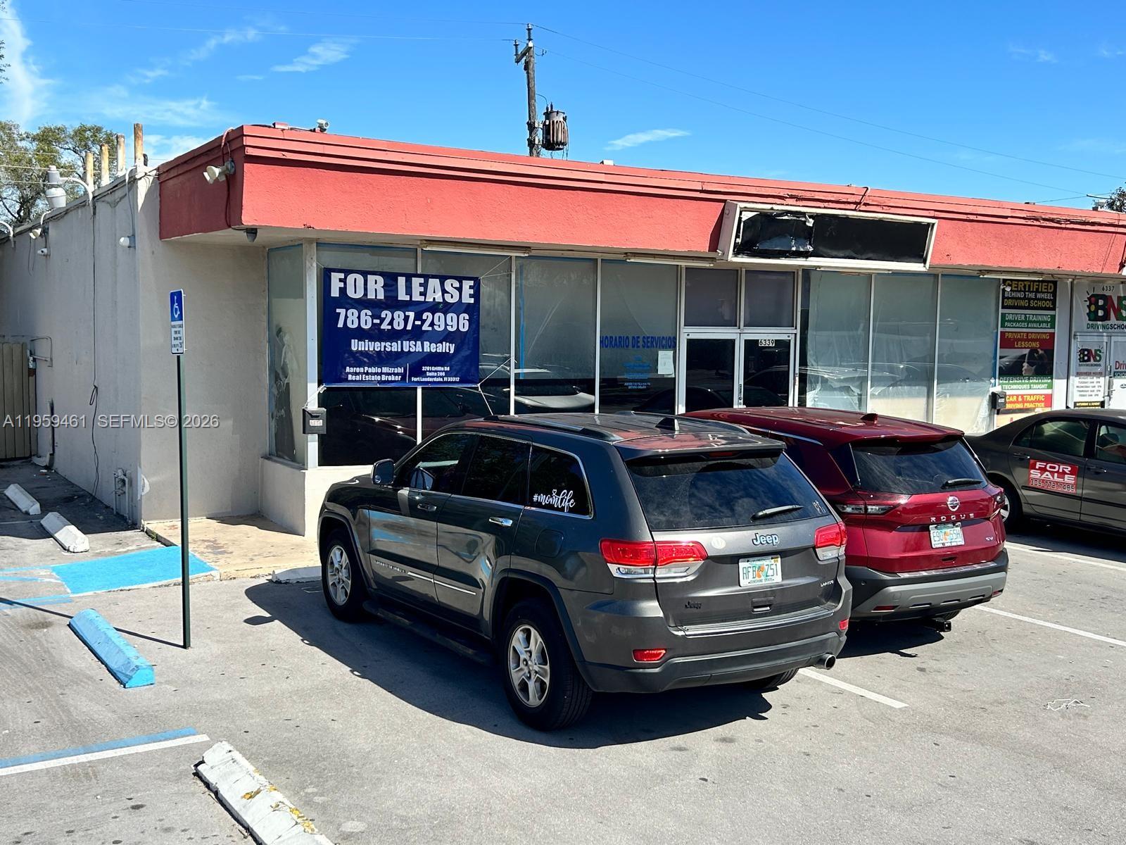 A commercial building exterior with a for lease sign and parked cars in the lot — 6339 Johnson St, Hollywood FL 33024, HOLLYWOOD, FL