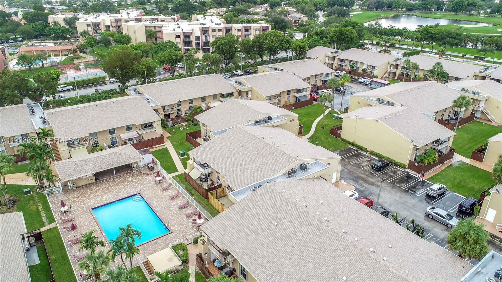 An aerial view shows multiple apartment buildings, a swimming pool, and a parking lot — 13785 SW 66th St # 239C, Miami FL 33183, MIAMI, FL