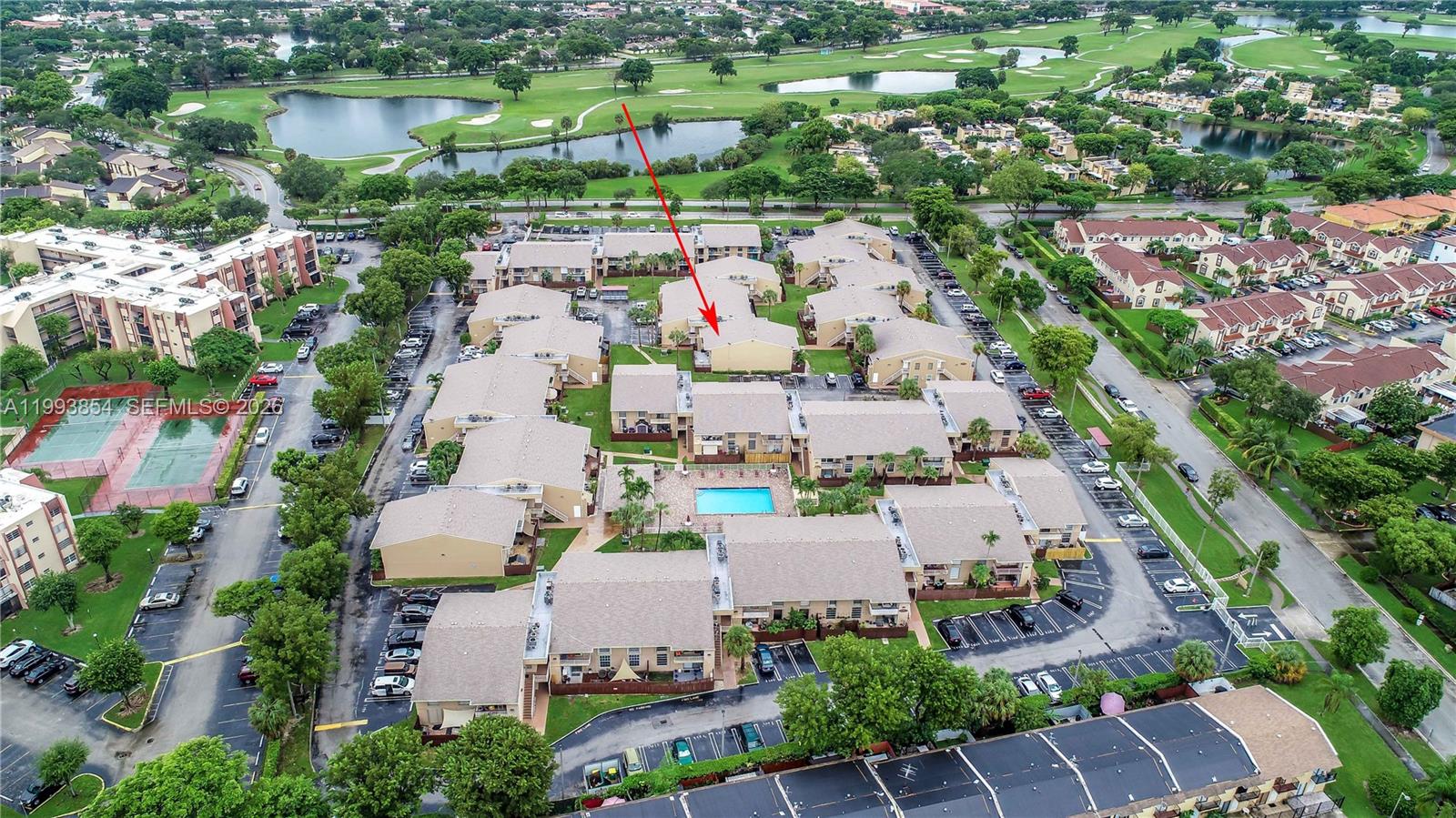 An aerial view shows a multi-building residential complex with a central swimming pool and parking — 13785 SW 66th St # 239C, Miami FL 33183, MIAMI, FL