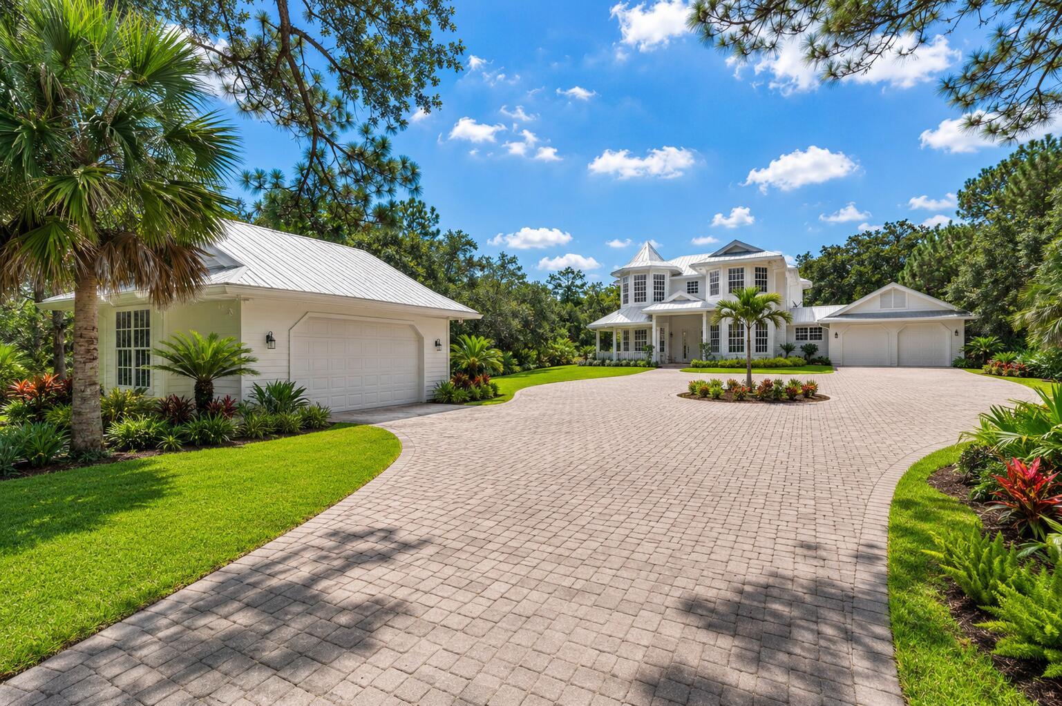 A large white house with a metal roof and a paved circular driveway — 1001 SE Ranch Road, Jupiter FL 33478, JUPITER, FL