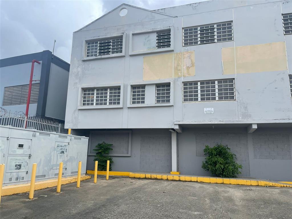 A three-story gray commercial building with louvered windows and a paved parking area — 662 DE DIEGO AVE SABANA LLANA WARD AVENUE, SAN JUAN, PR