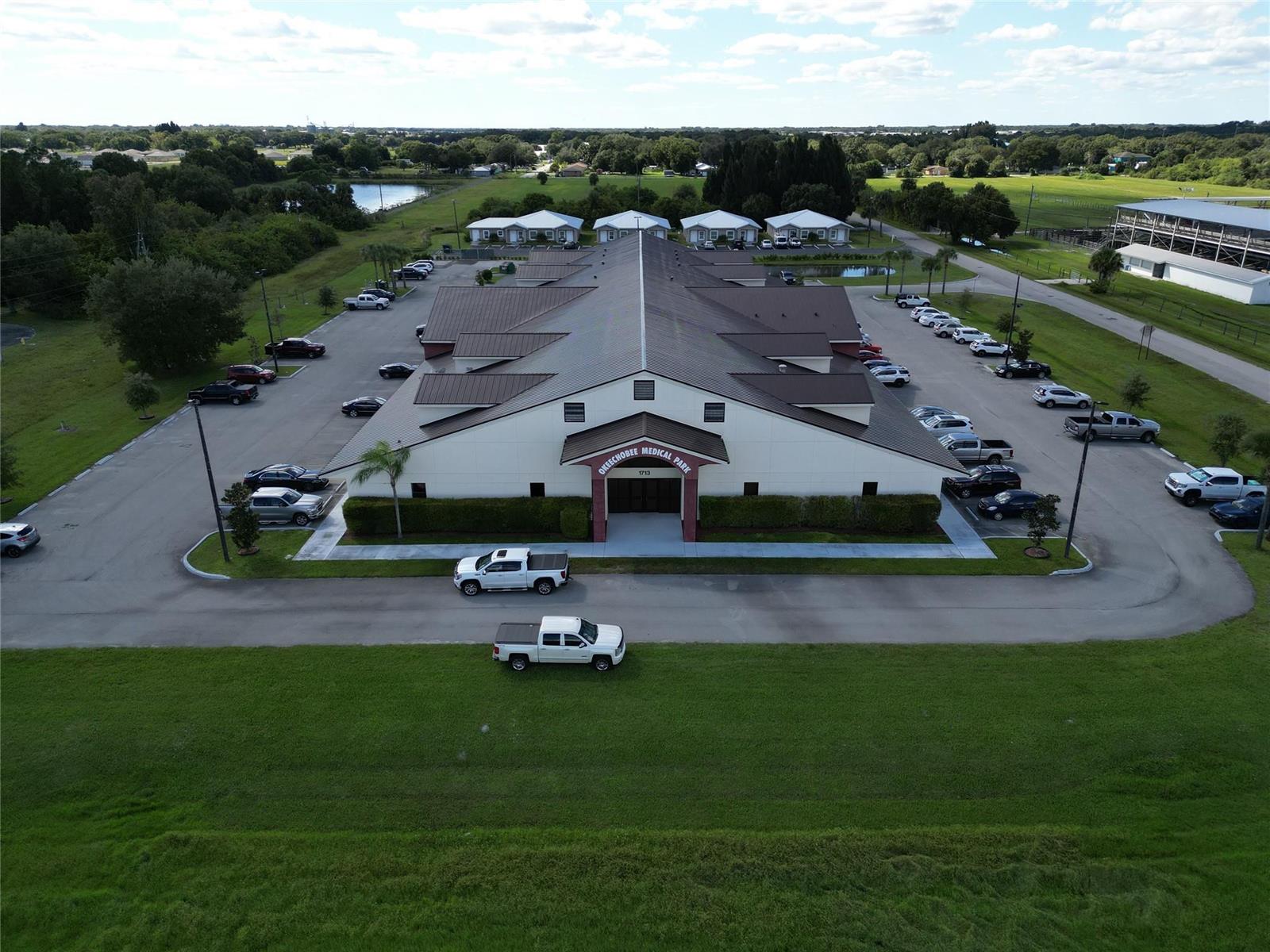 An aerial view of a medical park building with a large parking lot — 1713 US Highway 441 # F, Okeechobee FL 34972, OKEECHOBEE, FL