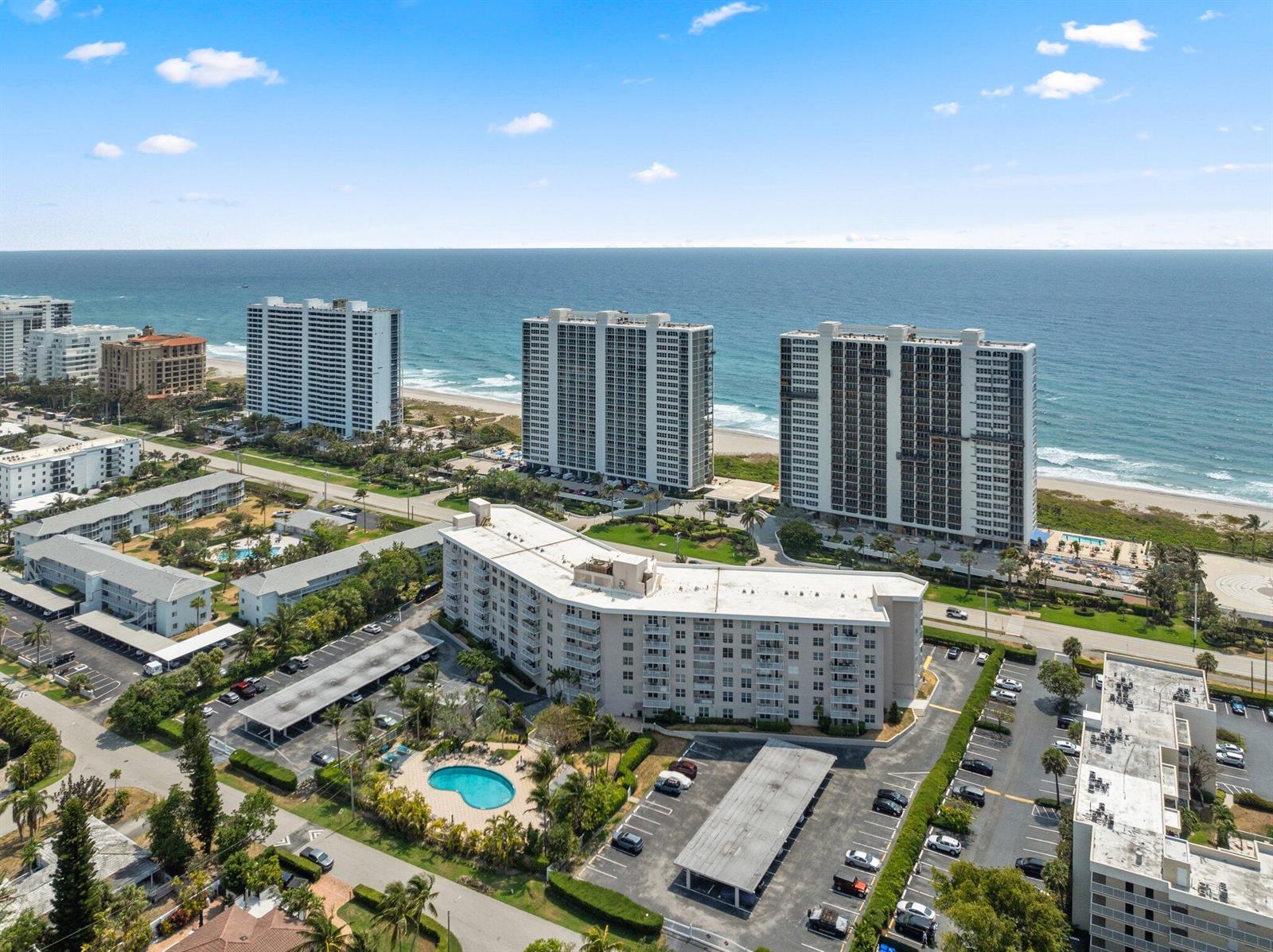 An aerial view shows several high-rise apartment buildings located along a sandy beach — 2851 S Ocean Boulevard # 6, Boca Raton FL 33432, BOCA RATON, FL