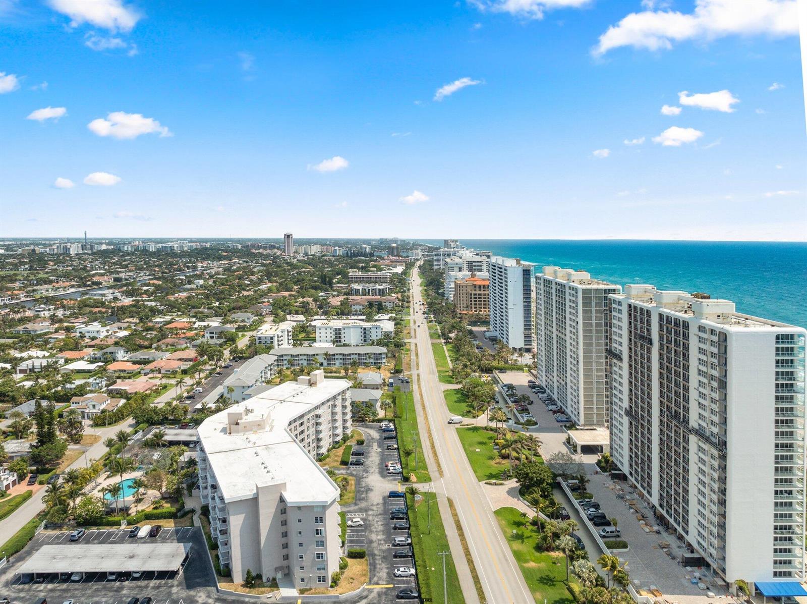 An aerial view shows a coastal road lined with high-rise apartment buildings and residential neighborhoods — 2851 S Ocean Boulevard # 6, Boca Raton FL 33432, BOCA RATON, FL