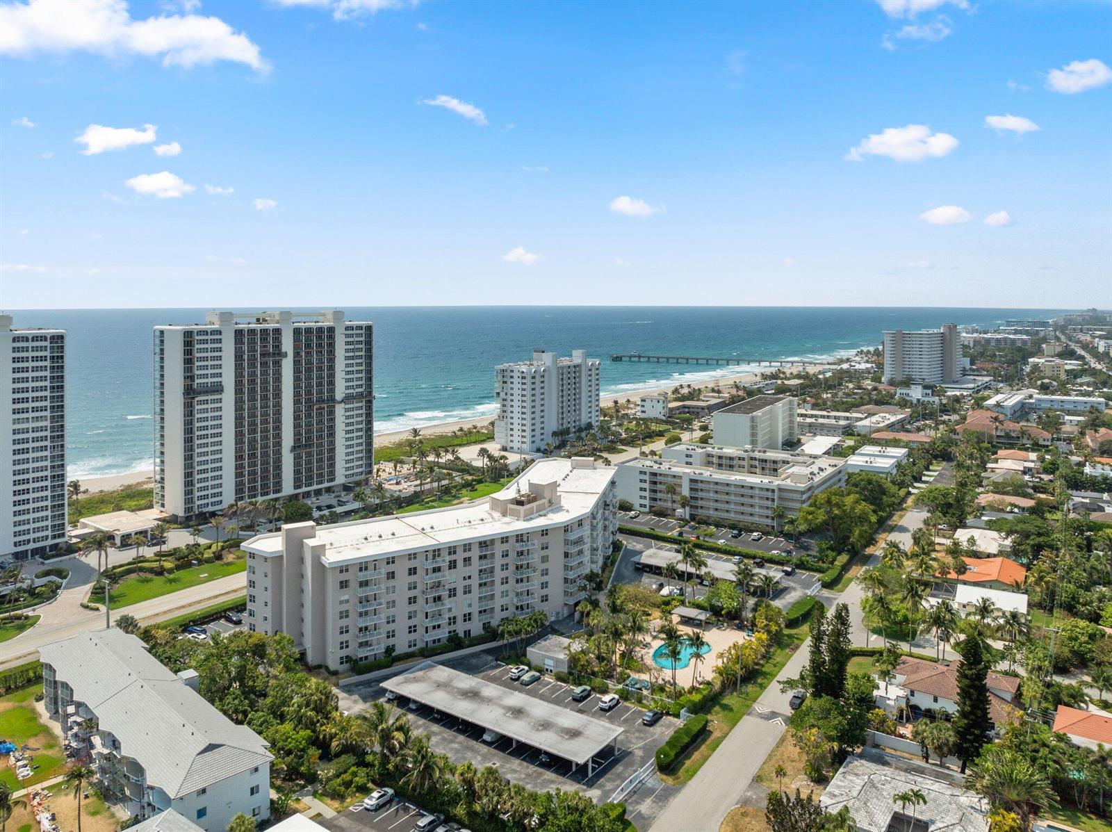 An aerial view shows several high-rise apartment buildings located along a sandy beach — 2851 S Ocean Boulevard # 6, Boca Raton FL 33432, BOCA RATON, FL