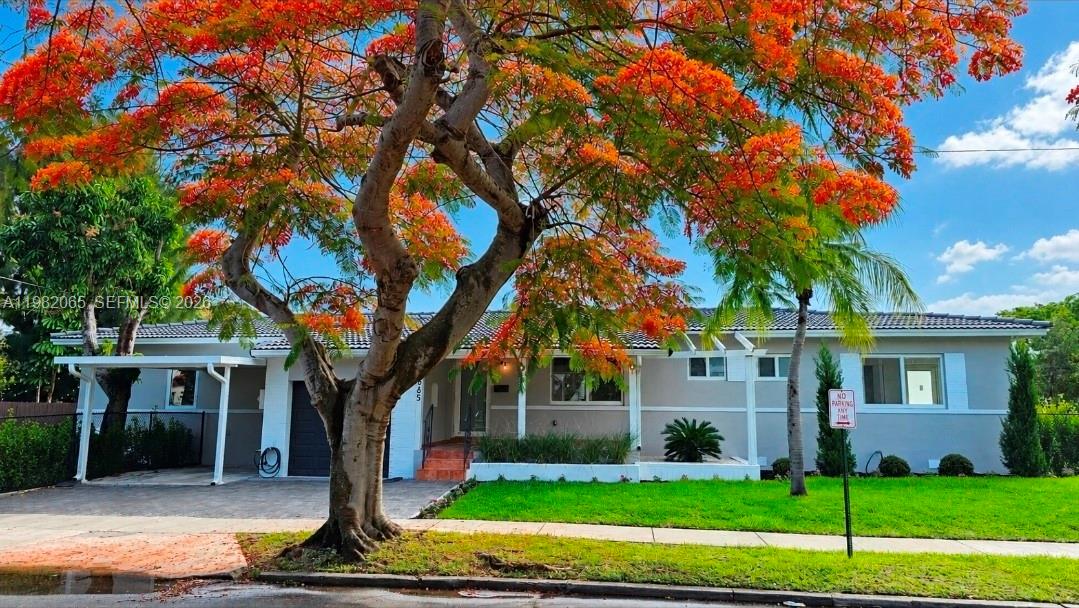 A single-story house with a large flowering tree in the front yard — 2365 SW 21st Ave, Miami FL 33145, MIAMI, FL