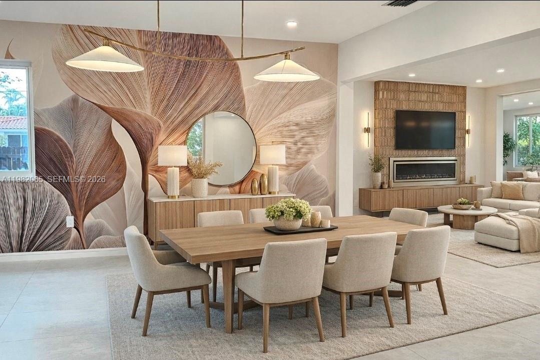 A dining room features a large leaf-patterned mural, a wooden table, and beige upholstered chairs — 2365 SW 21st Ave, Miami FL 33145, MIAMI, FL