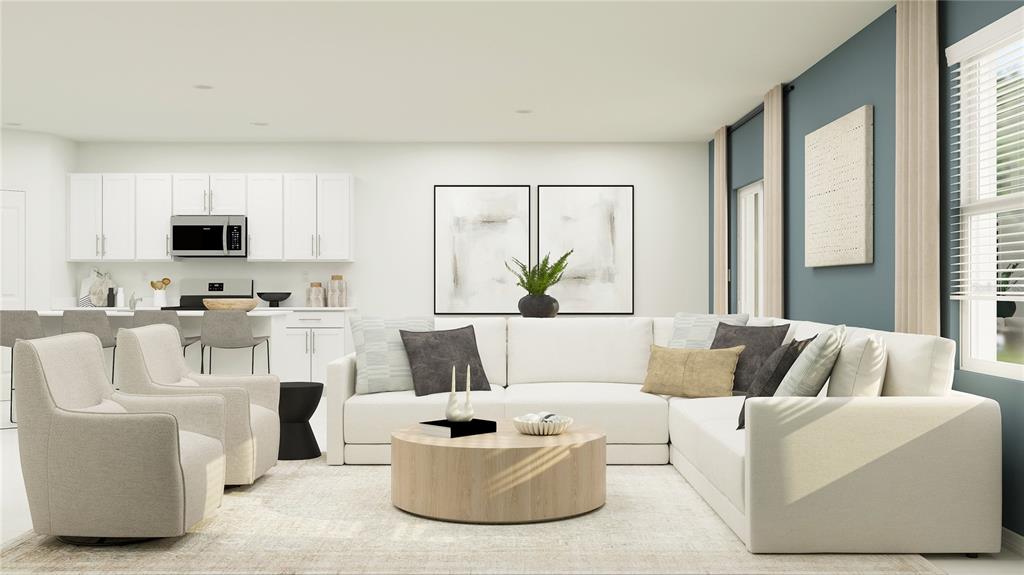 This is a rendering of an open-concept living room and kitchen with white cabinetry — 12140 NOBLE CHASE PATH, DADE CITY, FL