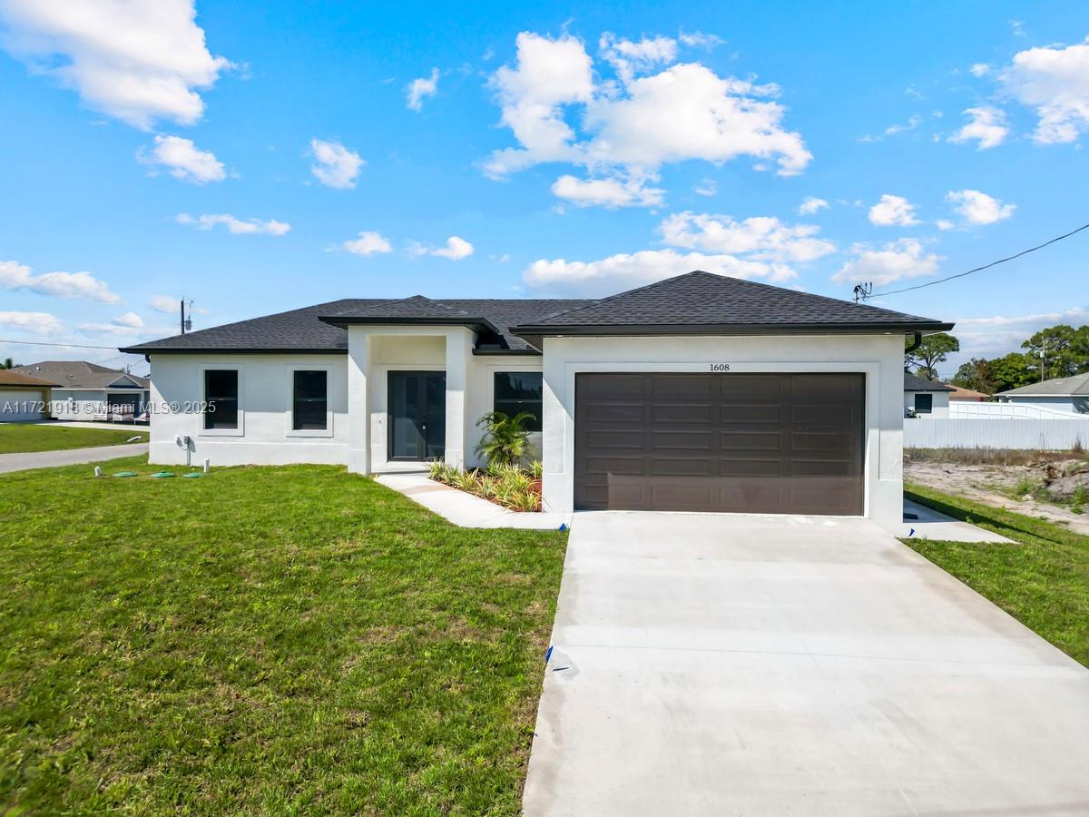1608 FLORA AVE S, Lehigh Acres FL 33976